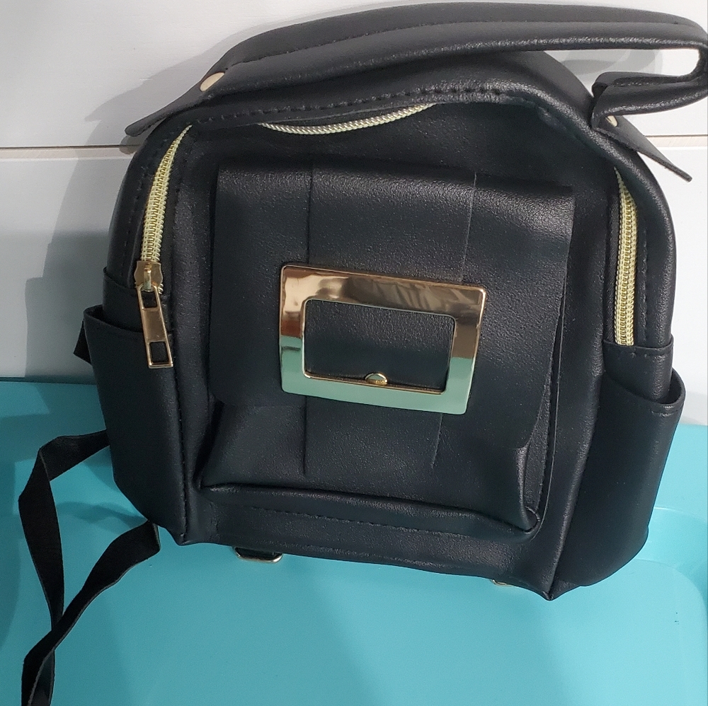 Elegant Black Backpack with Gold Accents